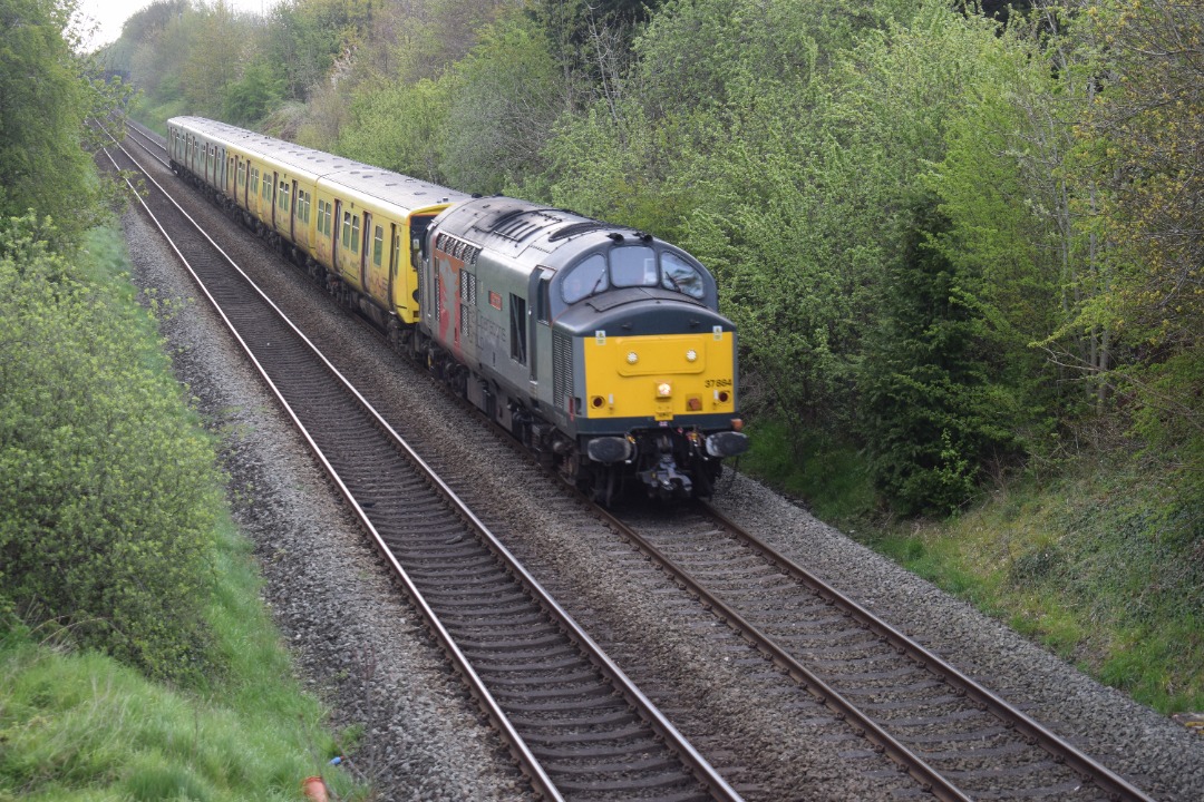 Hardley Distant on Train Siding: CURRENT: 37884 'Cepheus' hauls 507021 (Front) and 507014 (Rear - 2nd Photo) through Rhosymedre near Ruabon today with
the 5Q78 06:11...