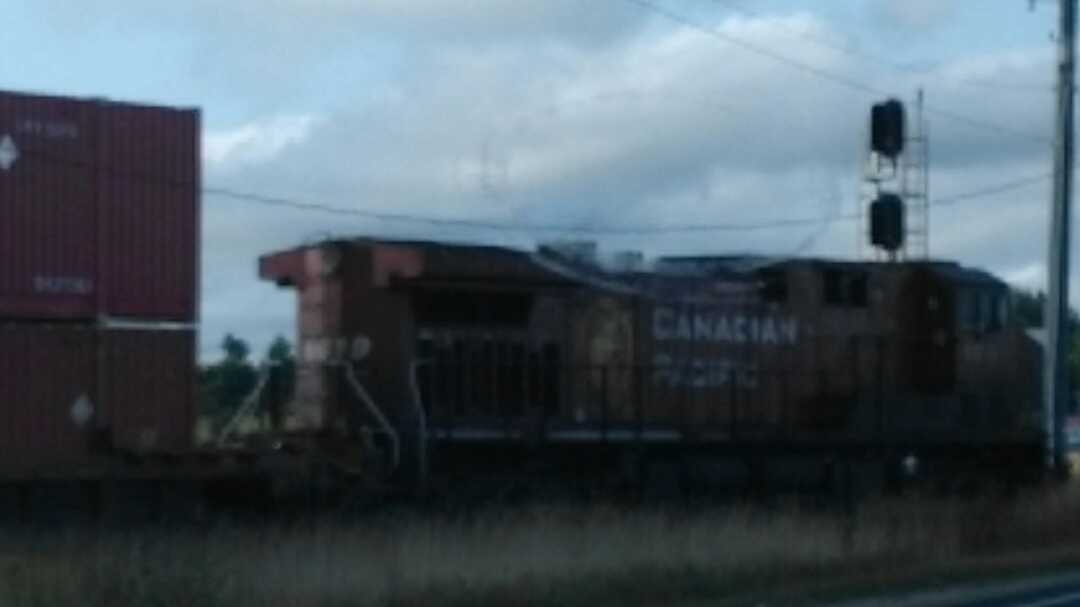 Ryan on Train Siding: Canadian Pacific locomotive at a level crossing near Brampton, Ontario. Didn't get the number, sadly.