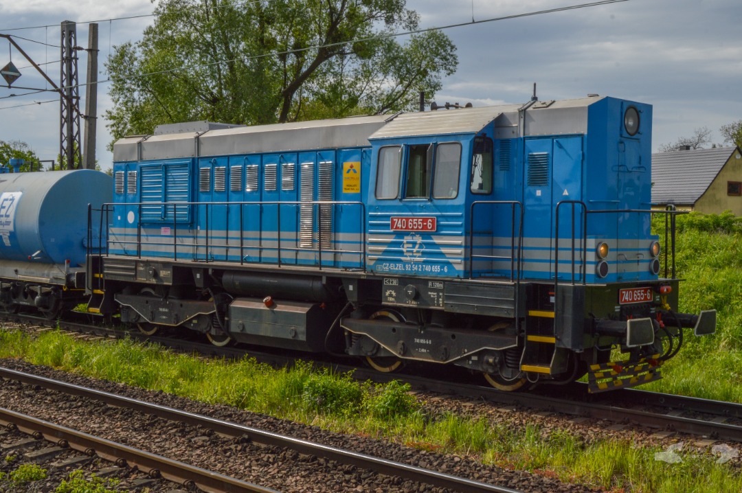 Adam L. on Train Siding: An 740 Class Diesel, owned and operated by the Czech Elektrizace Železnic Praha, coupled to a maintenance of way train owned by the
same firm...