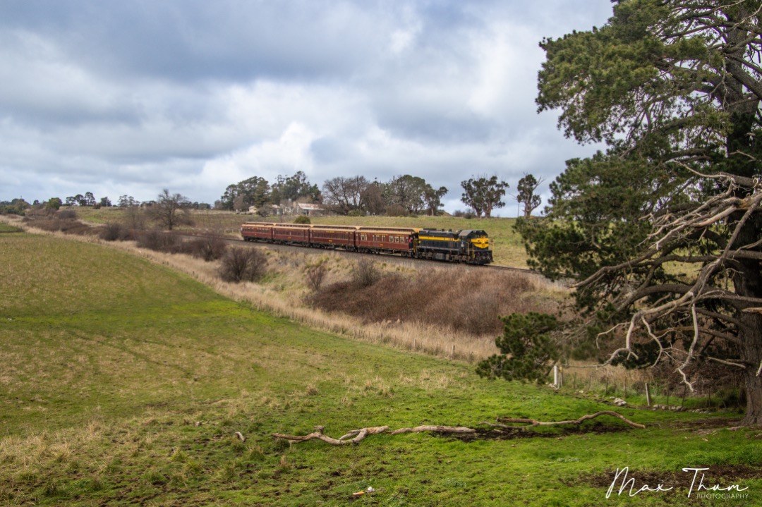 Max Thum on Train Siding: Meandering through the open fields, X31 makes ease of the single track section between Kyneton and Taradale.