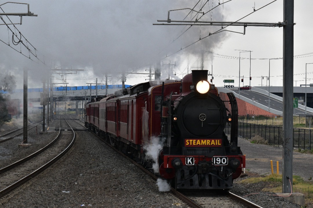 Shawn Stutsel on Train Siding: Steamrail's K190 races through Hoppers Crossing Station, Melbourne on route to Geelong with the Rail and Sail tour, running
as 8297...