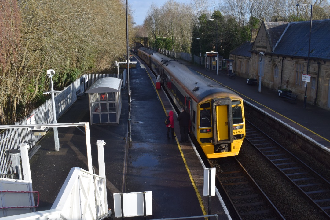 Hardley Distant on Train Siding: CURRENT: 150283 (Leading) and 158837 (Rear) call at Ruabon Station today with the 1D12 09:08 Birmingham International to
Holyhead...